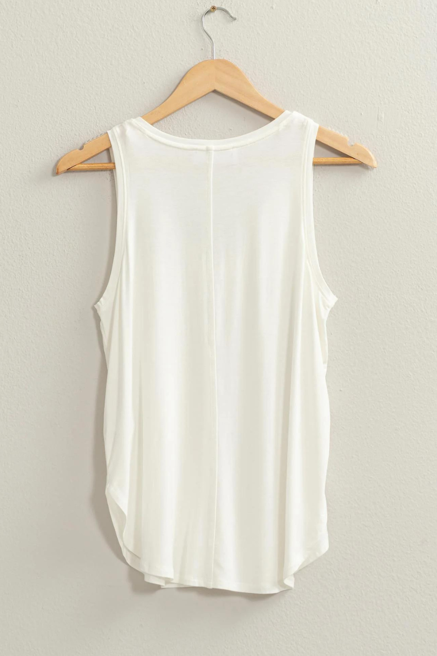 back view of the joey v neck tank in the color ivory hanging on a hanger 