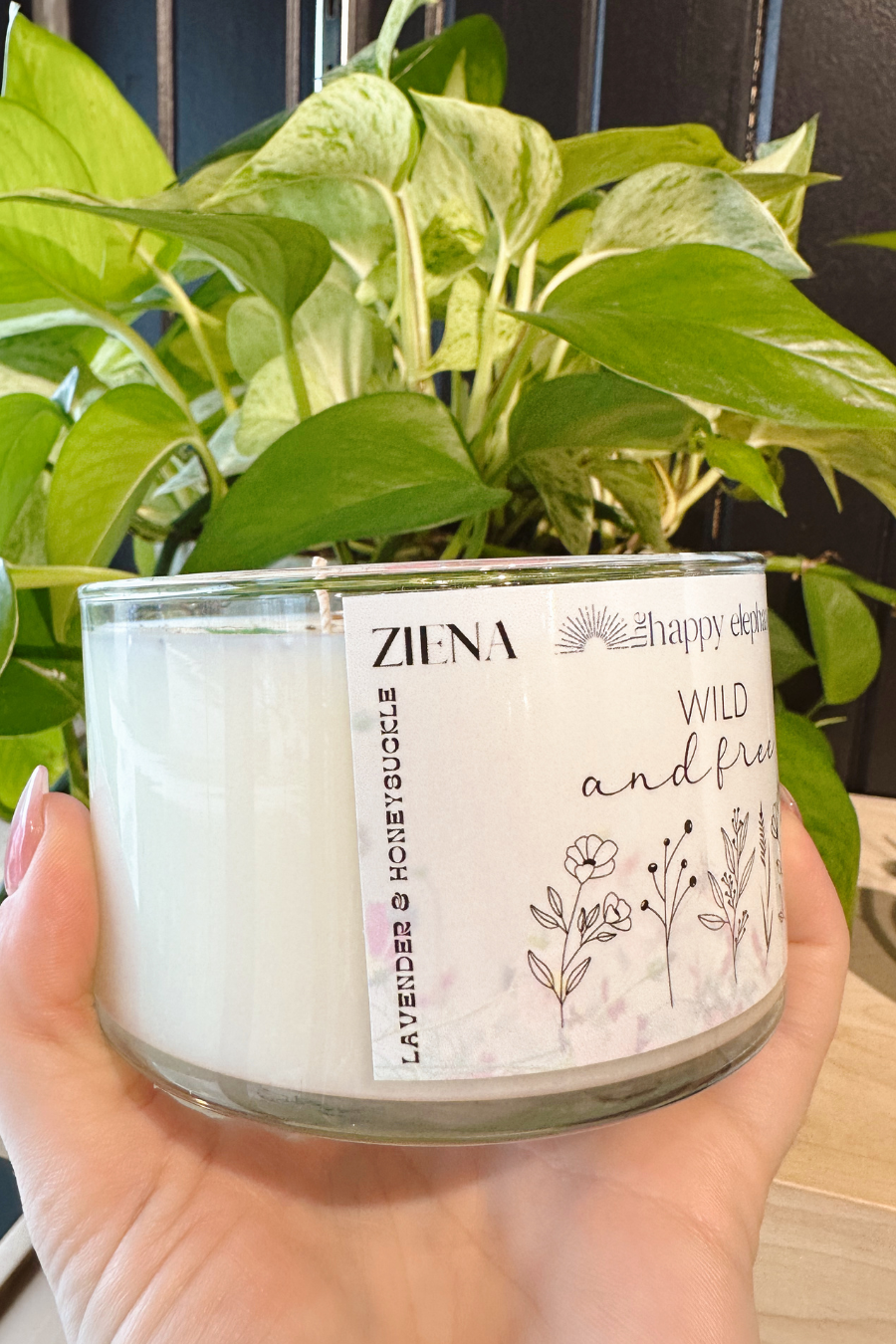 close up of side of wild and free candle with scent profile of lavender and honeysuckle 