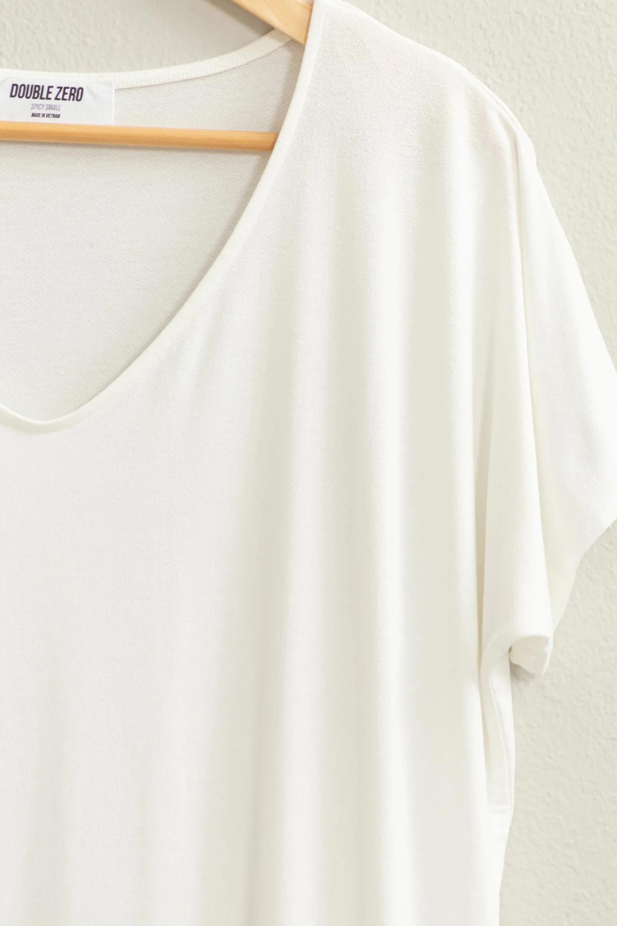 close up front view of the andi tee in the color ivory 