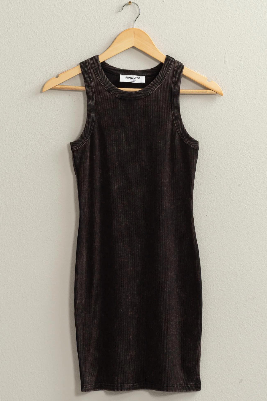 close up front view of lux acid wash ribbed tank dress in the color black, hanging on a wooden hanger 