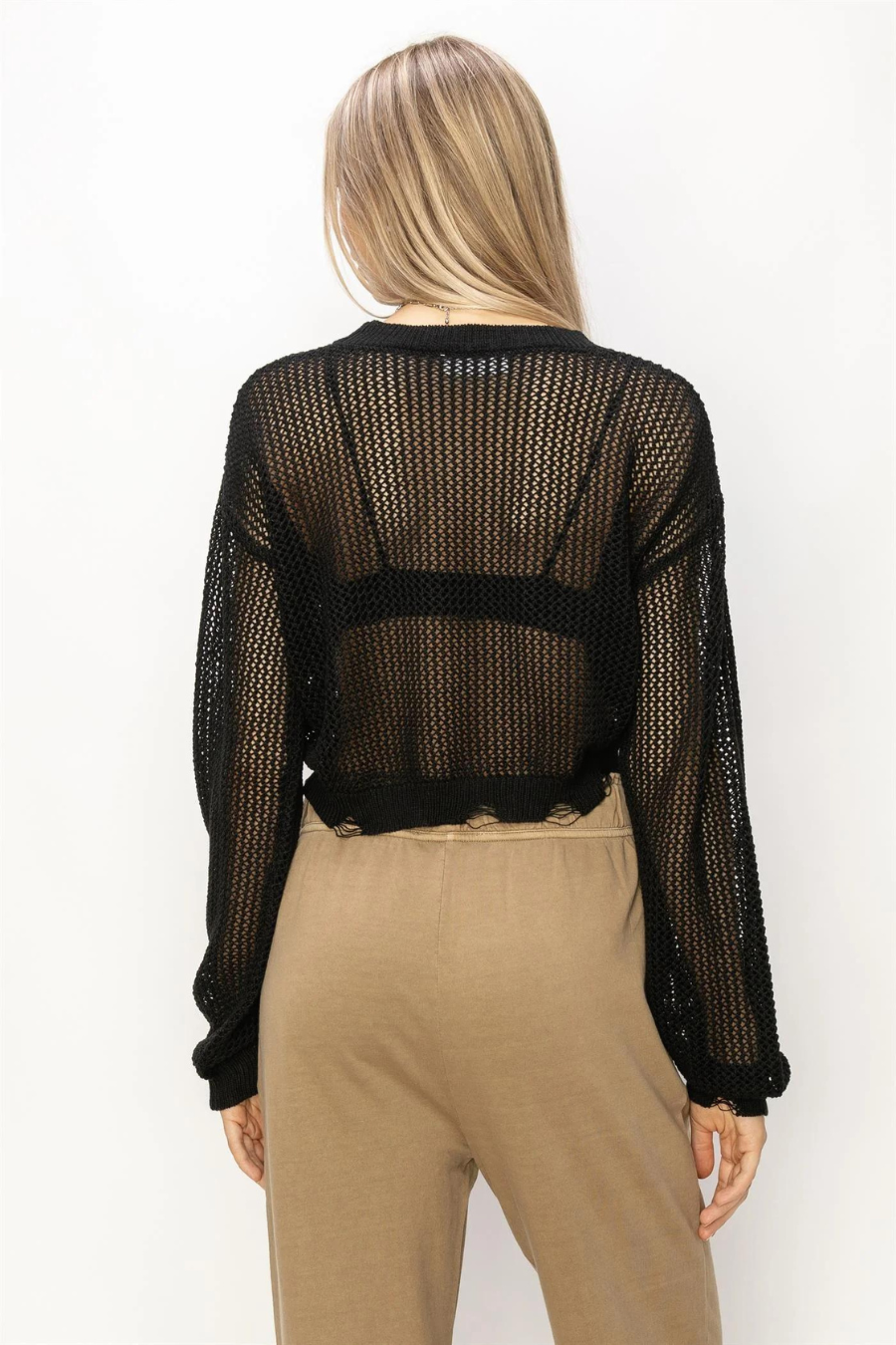 back view of the junie distressed sweater in the color black 