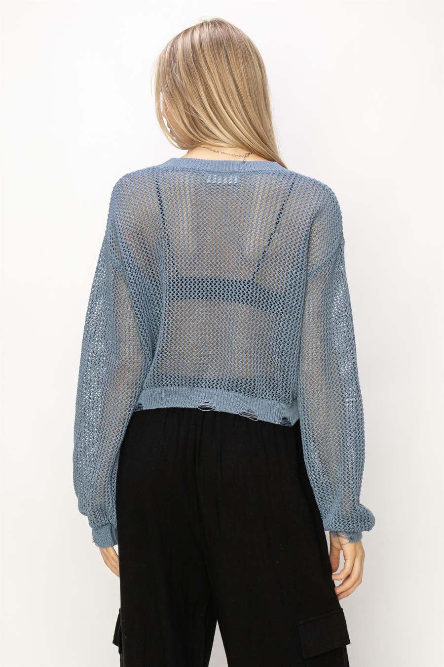back view of junie distressed knit sweater in the color ocean 