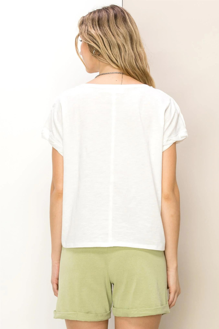 back view of hunter raw edge shirt. model is wearing it with green shorts