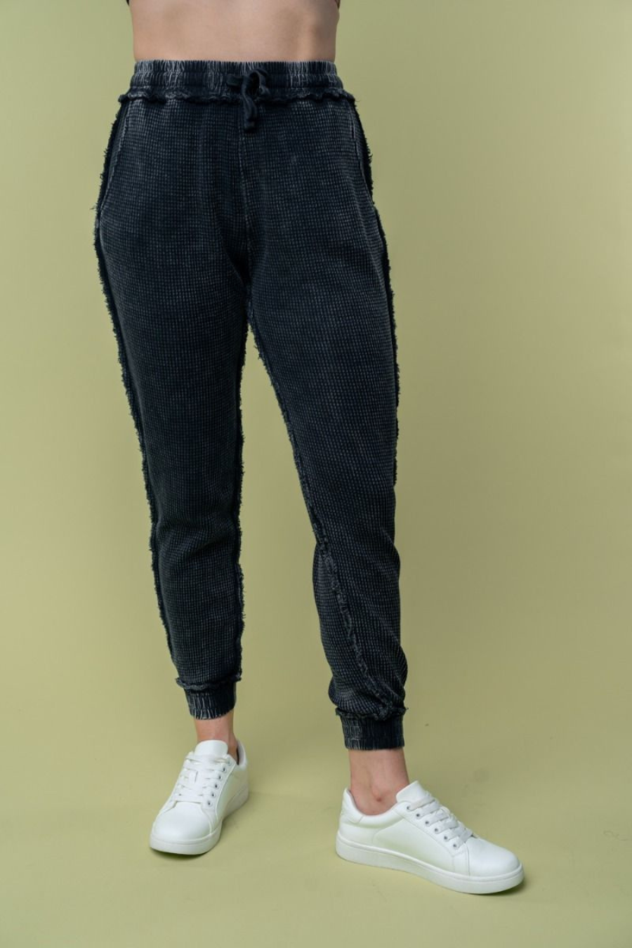 Close up front view of Hanny high waisted thermal knit pants in black