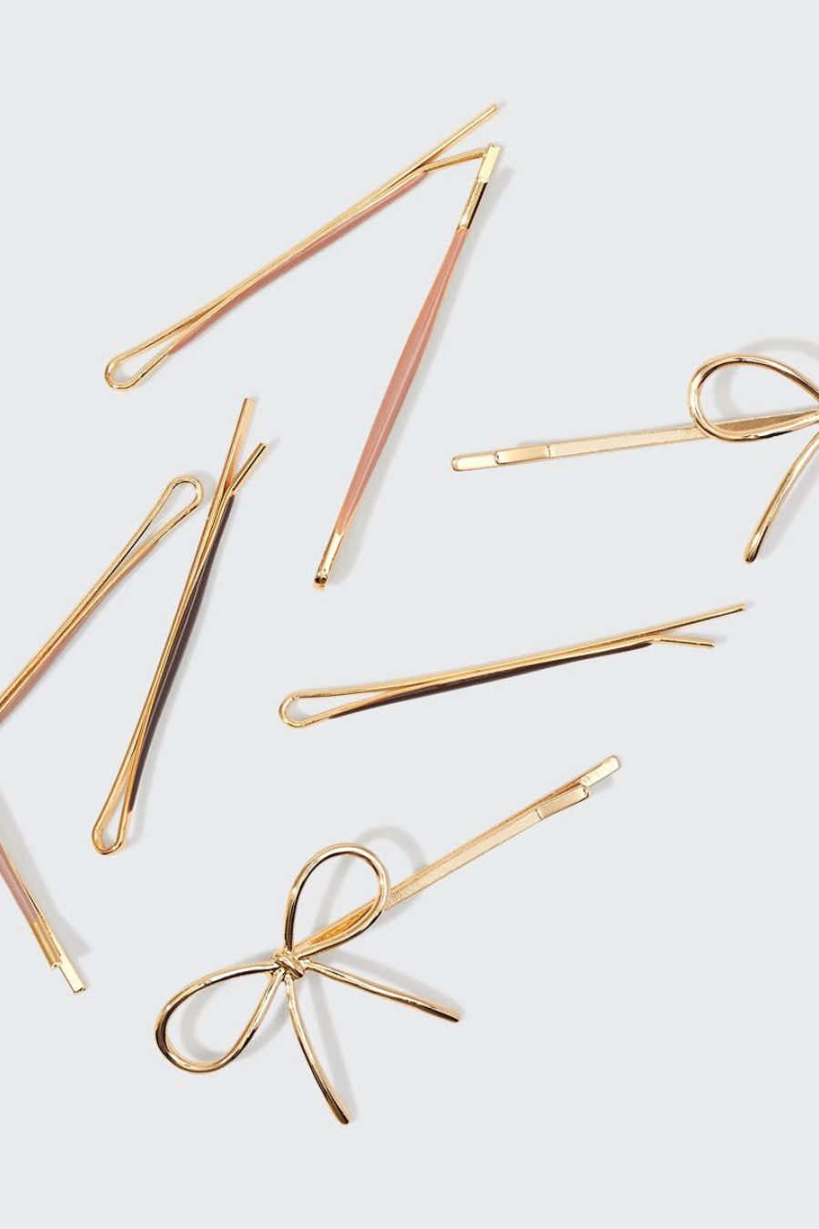 rosegold bobby-pins with a bow