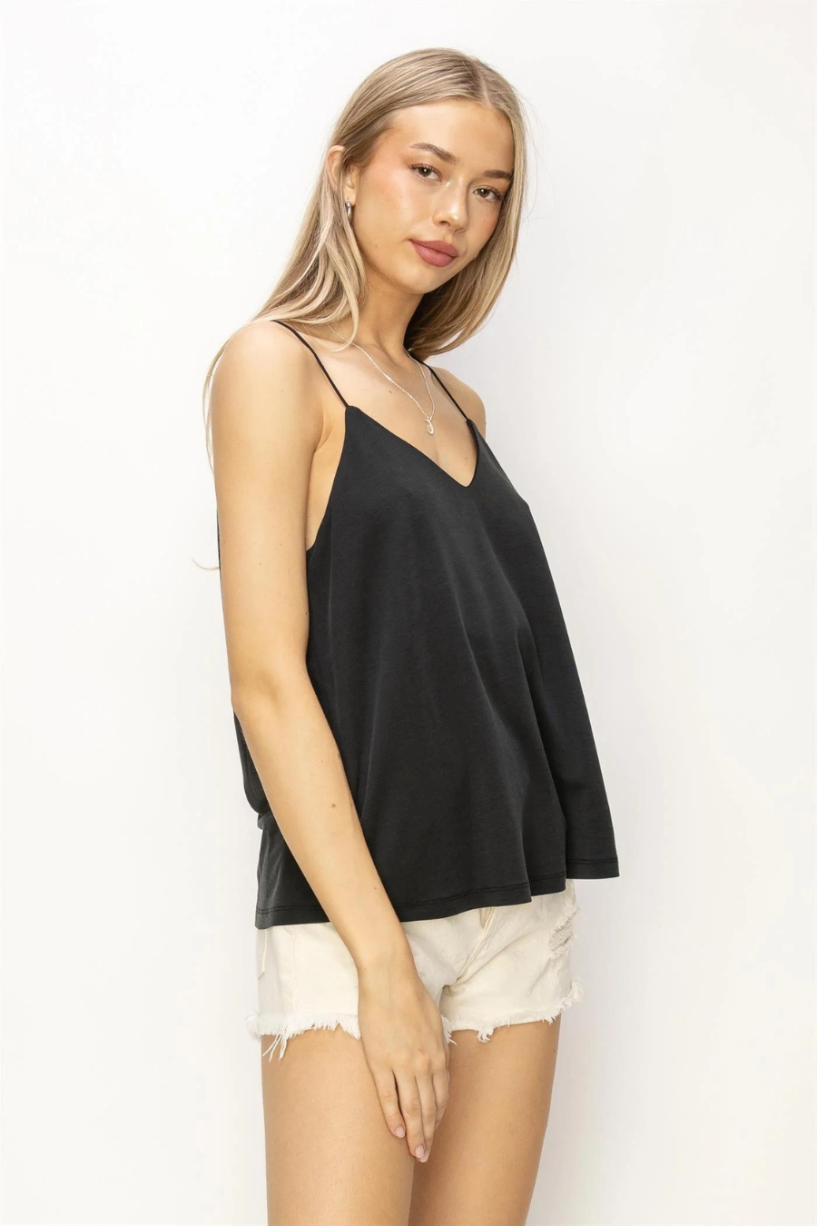 side front close up view of the Romee v neck cami in the color black
