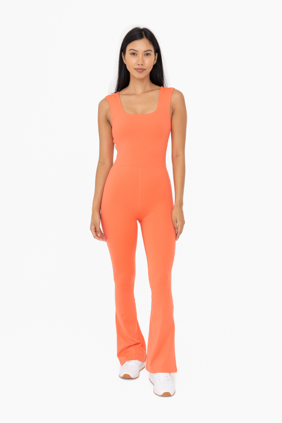 front full length view of the Venice twist back flare jumpsuit in the color coral