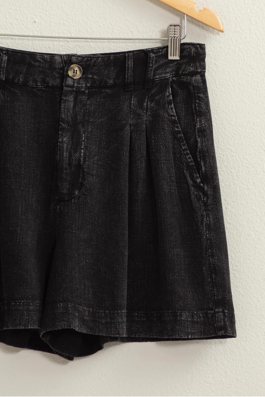 close up of black mineral washed linen shorts