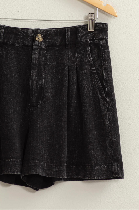 close up of black mineral washed linen shorts
