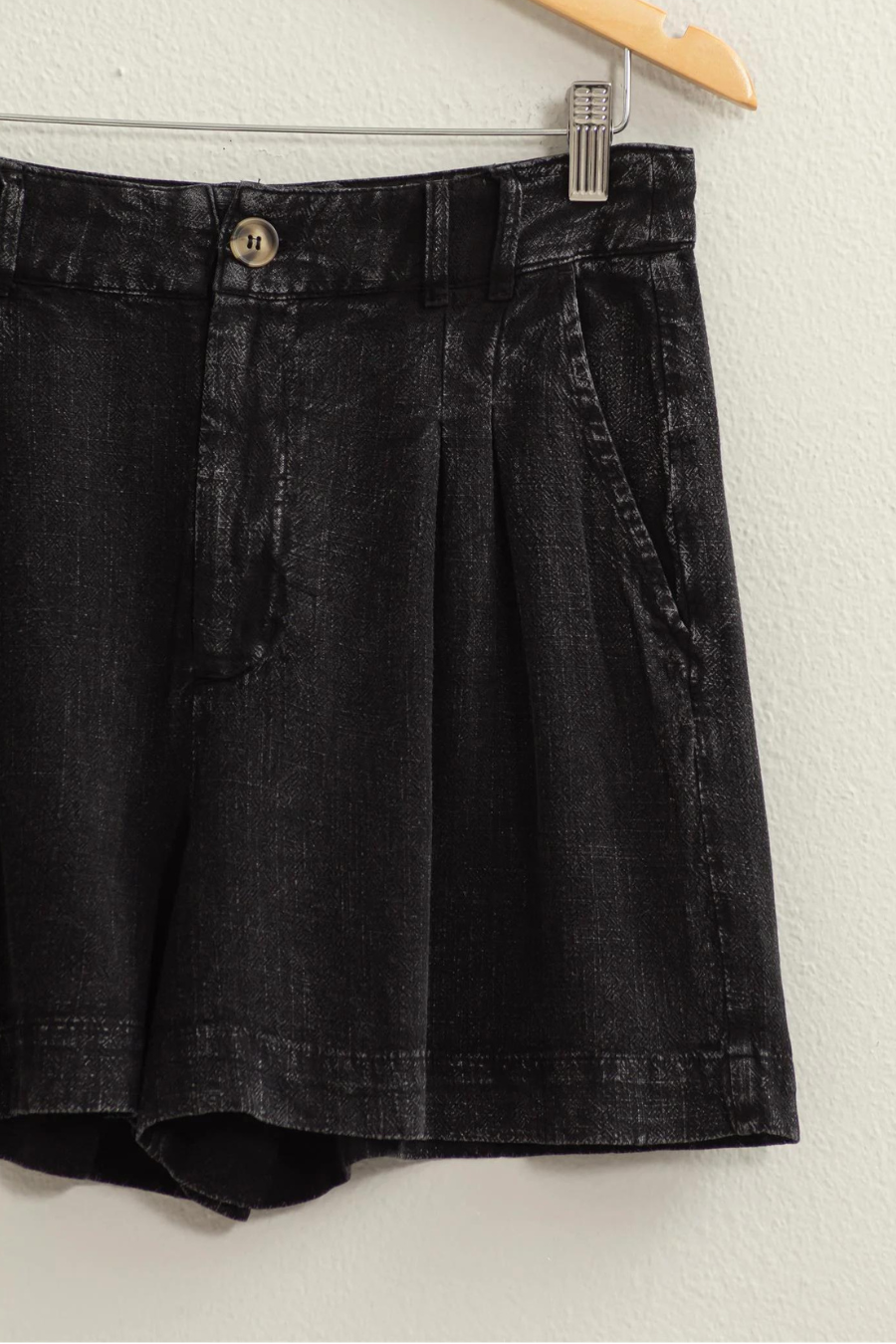 close up of black mineral washed linen shorts 