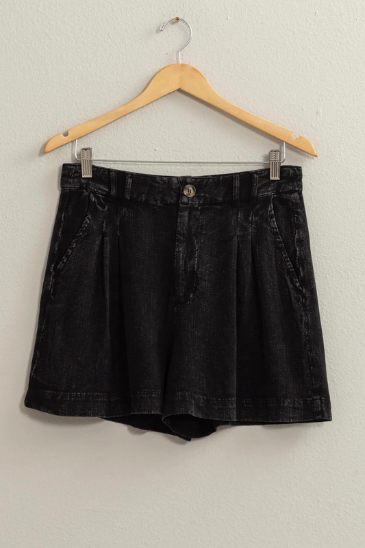 full view of black linen shorts of hanger
