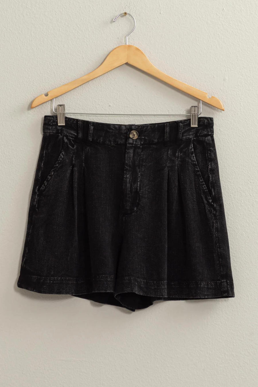 full view of black linen shorts of hanger 