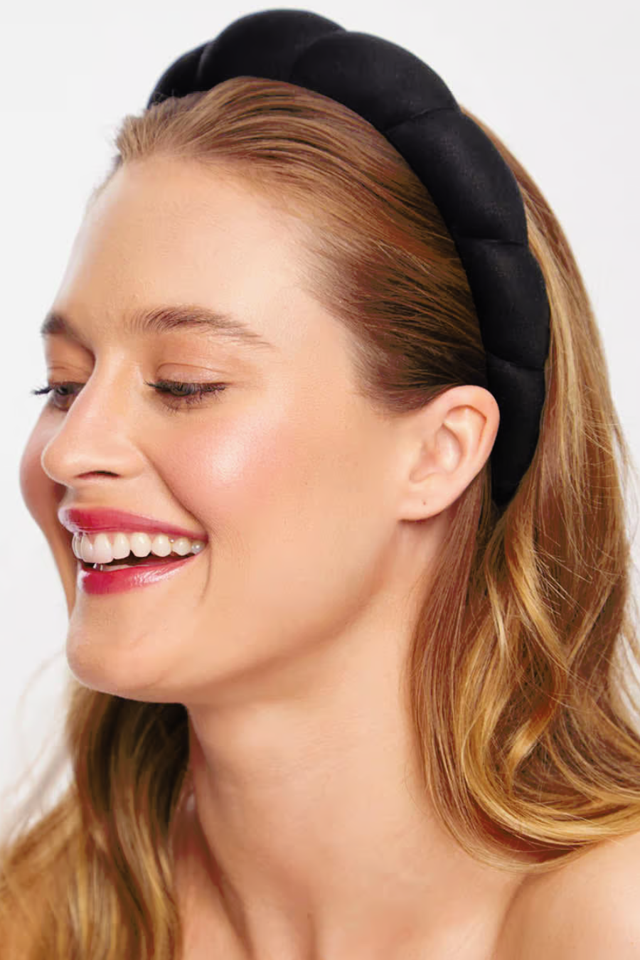 girl smiling wearing black headband 