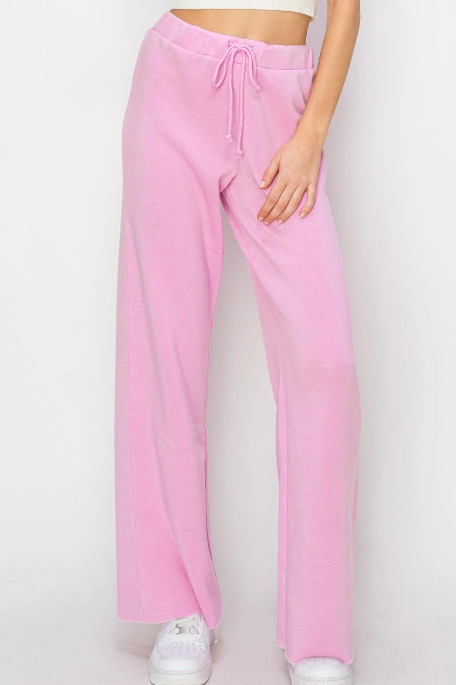 close up of front of pink eve draw string flare pant 