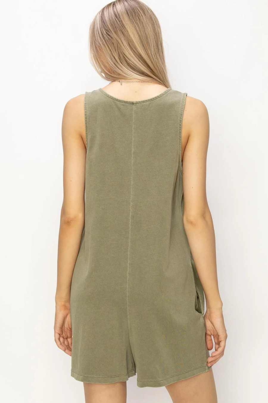 showing back view of olive romper 