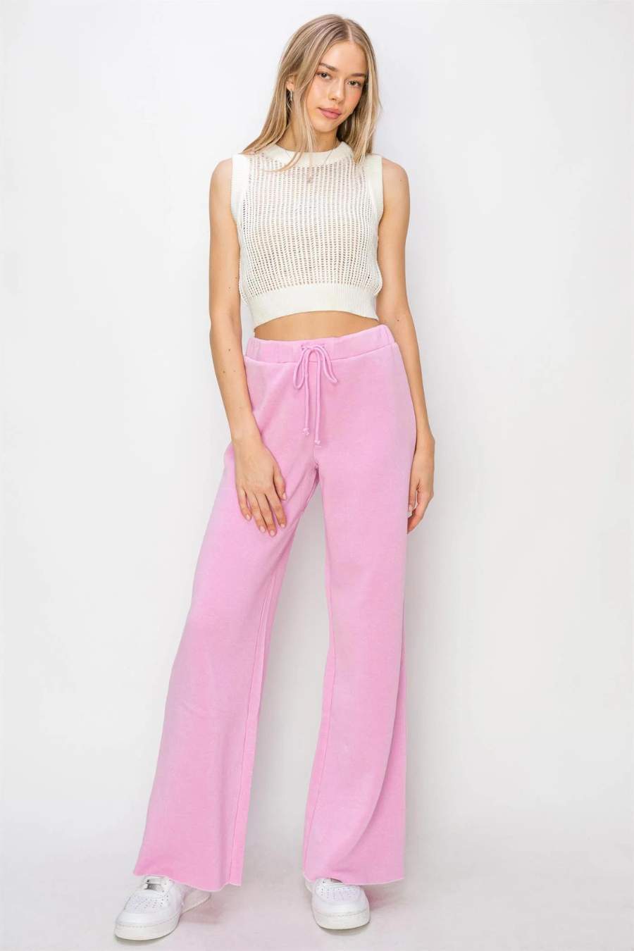 full length shot of girl wearing eve drawstring flare pants in pink