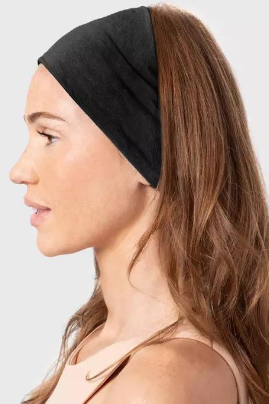 girl with hair down and pulled back by black fabric headband 