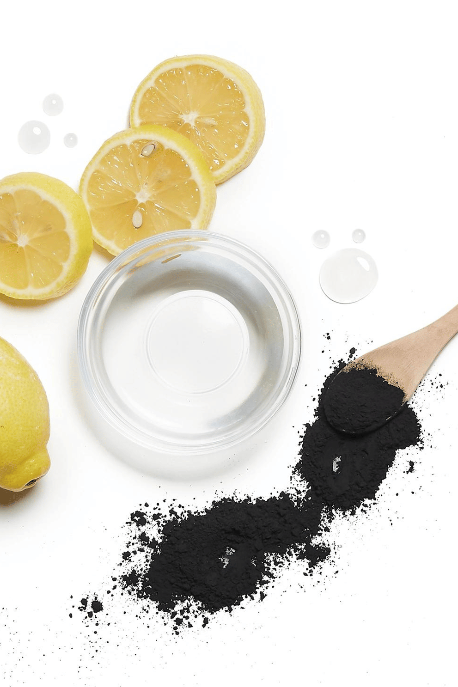 lemons, water, charcoal with a wooden spoon