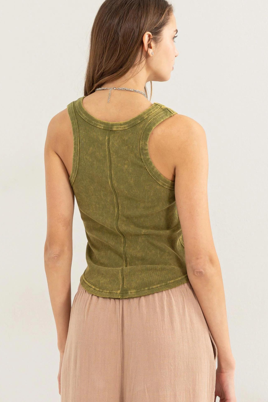 close up back shot of girl wearing dixie acid wash tank in olive 