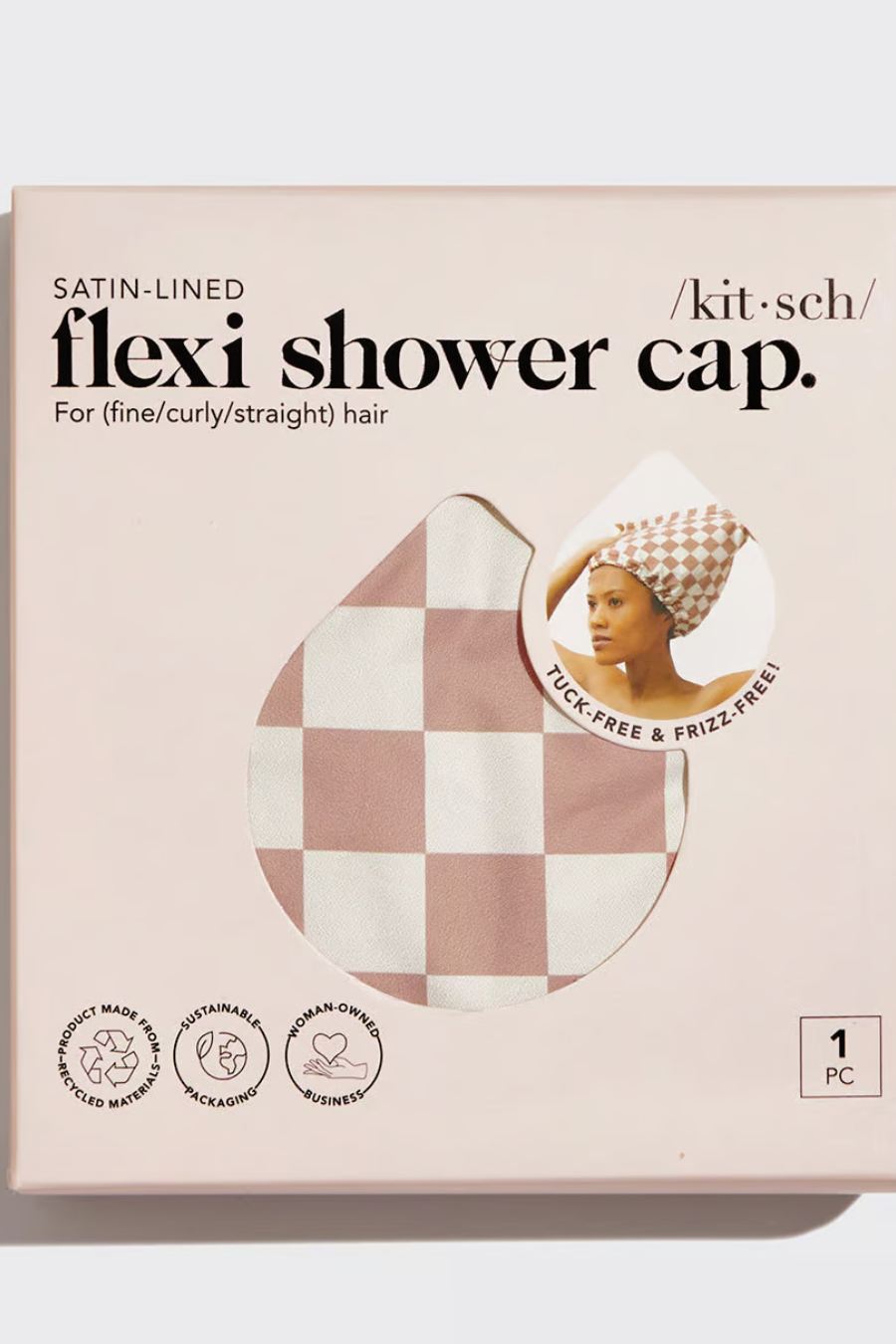 blush checkered shower cap in its packaging 