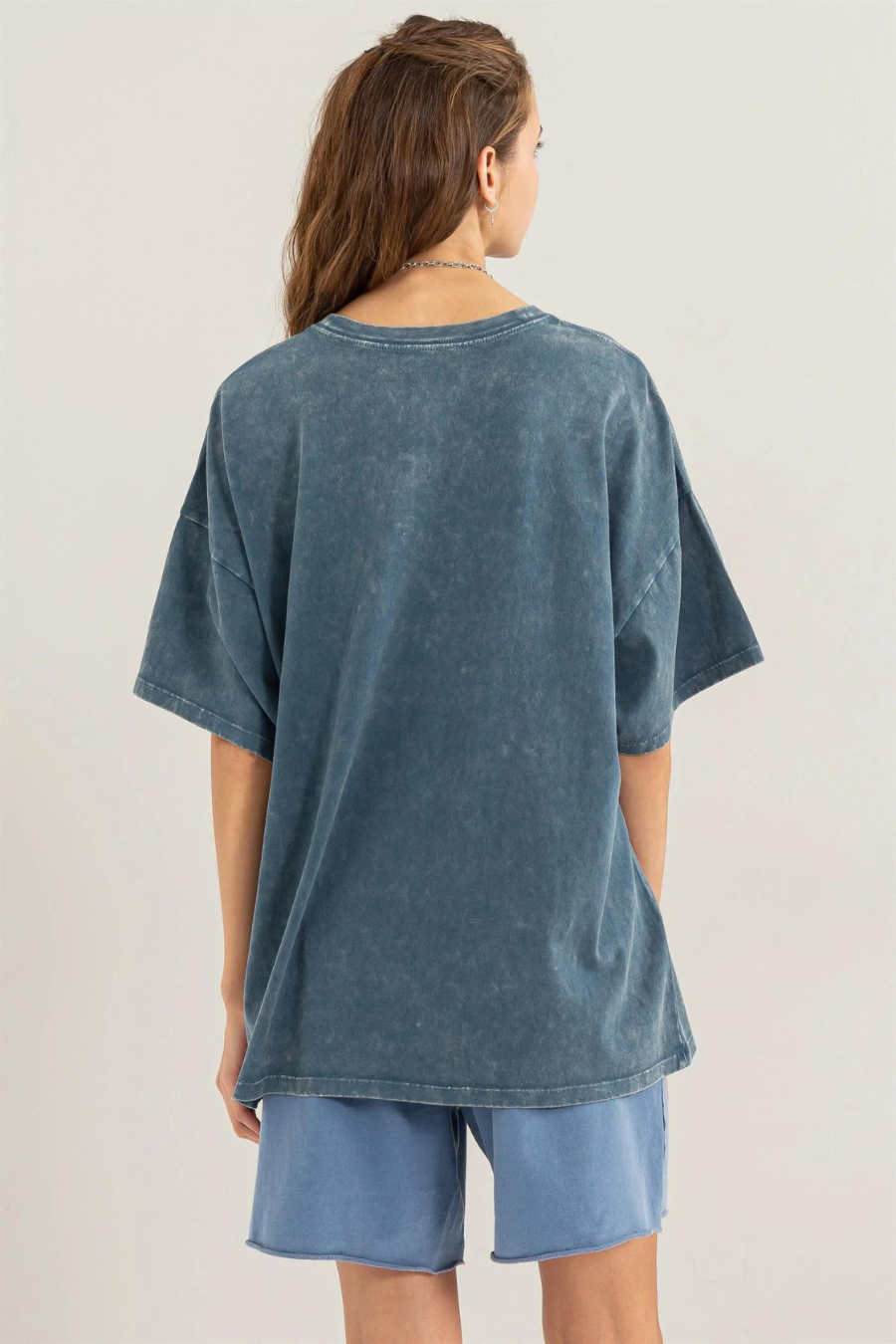 back view of girl wearing Maisie over sized t shirt in teal 