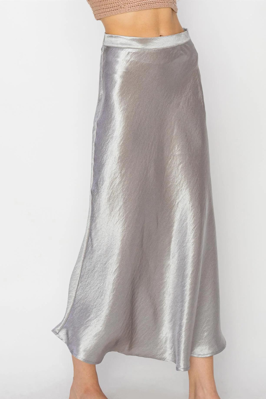 front side angle of the Lala satin midi skirt in the color silver 