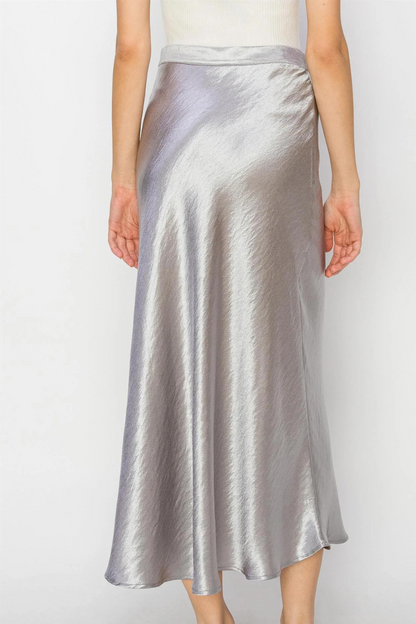 back view of the Lala satin midi skirt in the color silver 