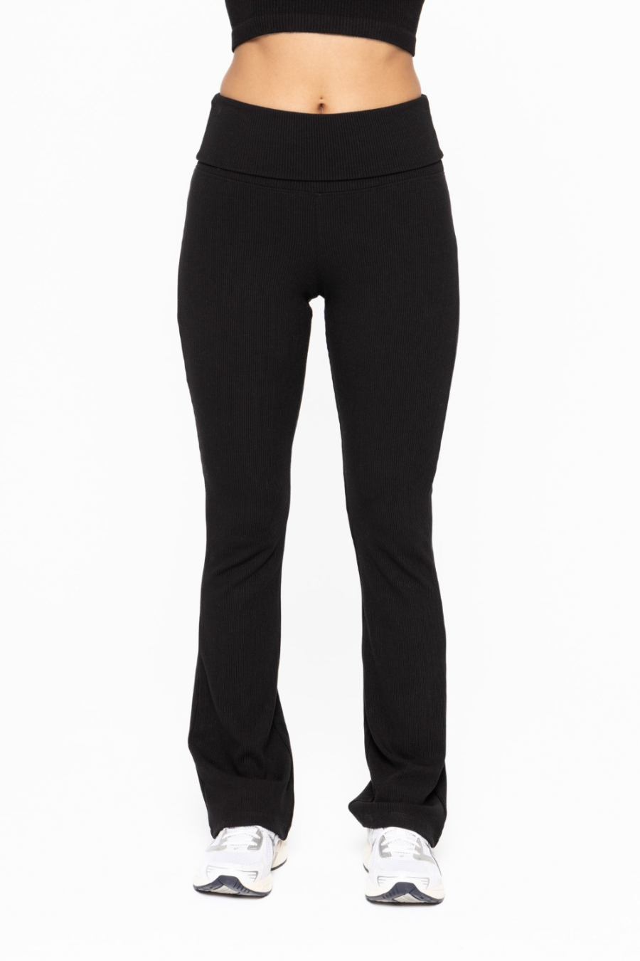front view of the folded over waist flare pants in the color black 