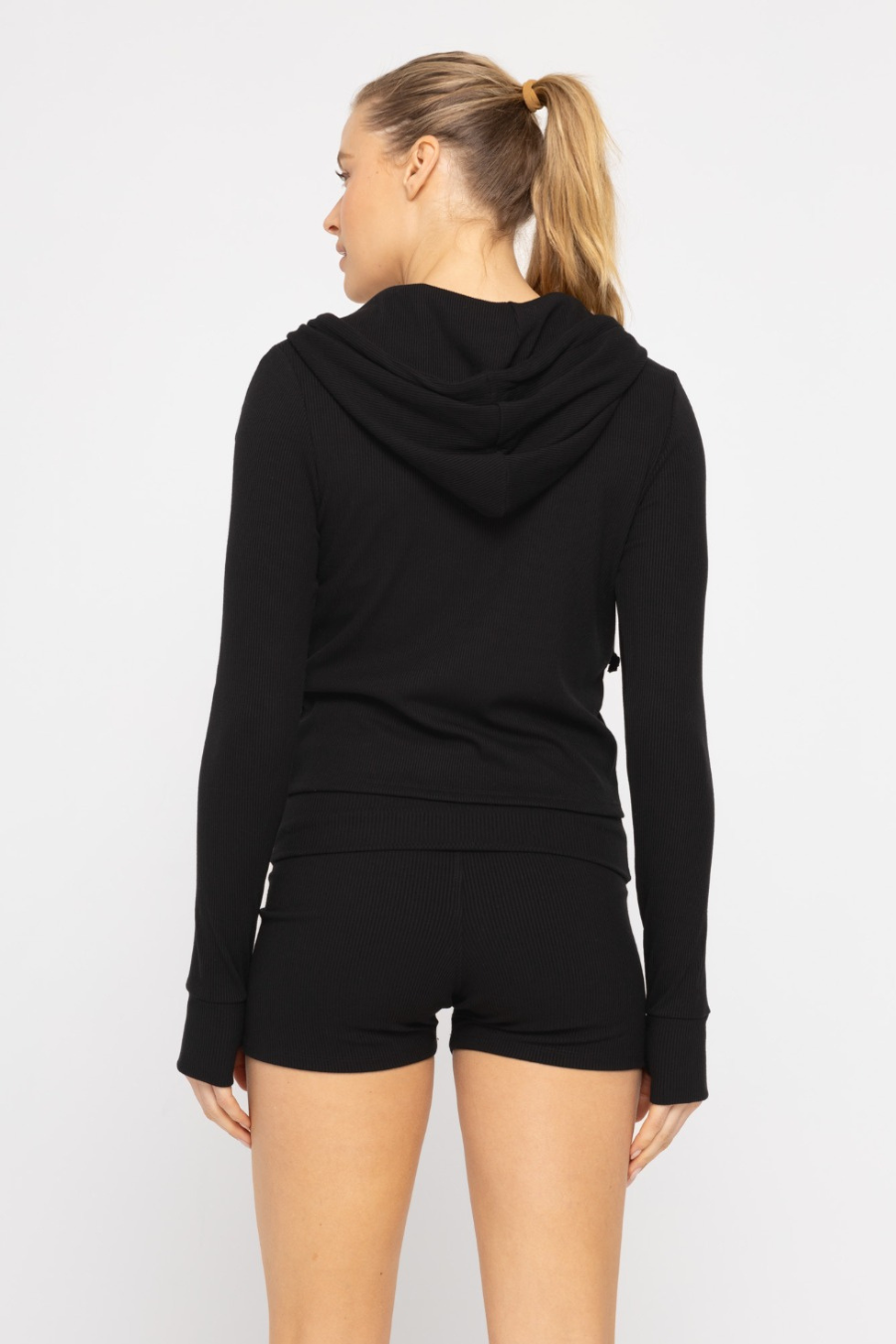 back view of the ribbed lounge hoodie in the color black 