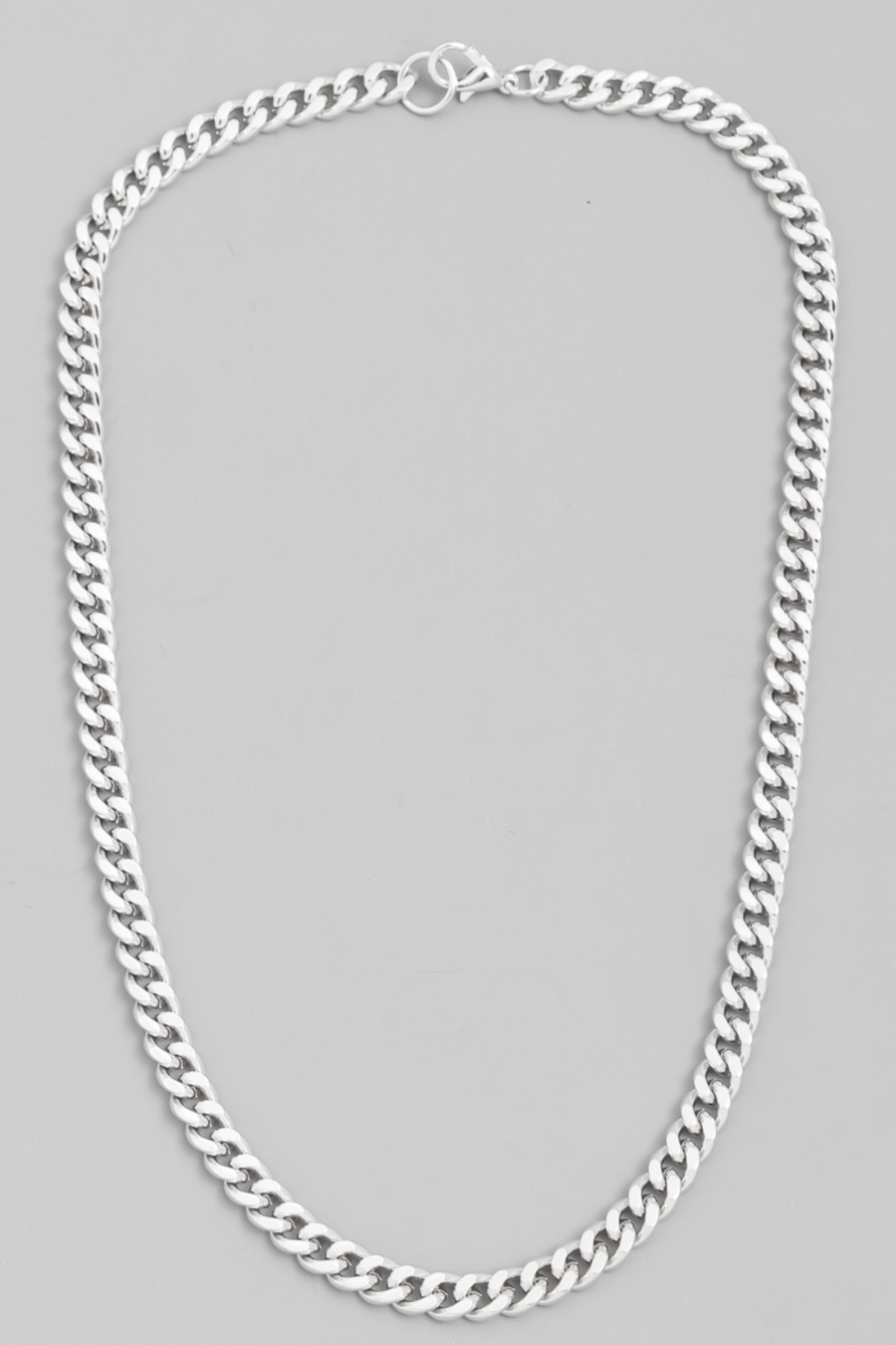close up flat lay photo of silver link chain necklace 
