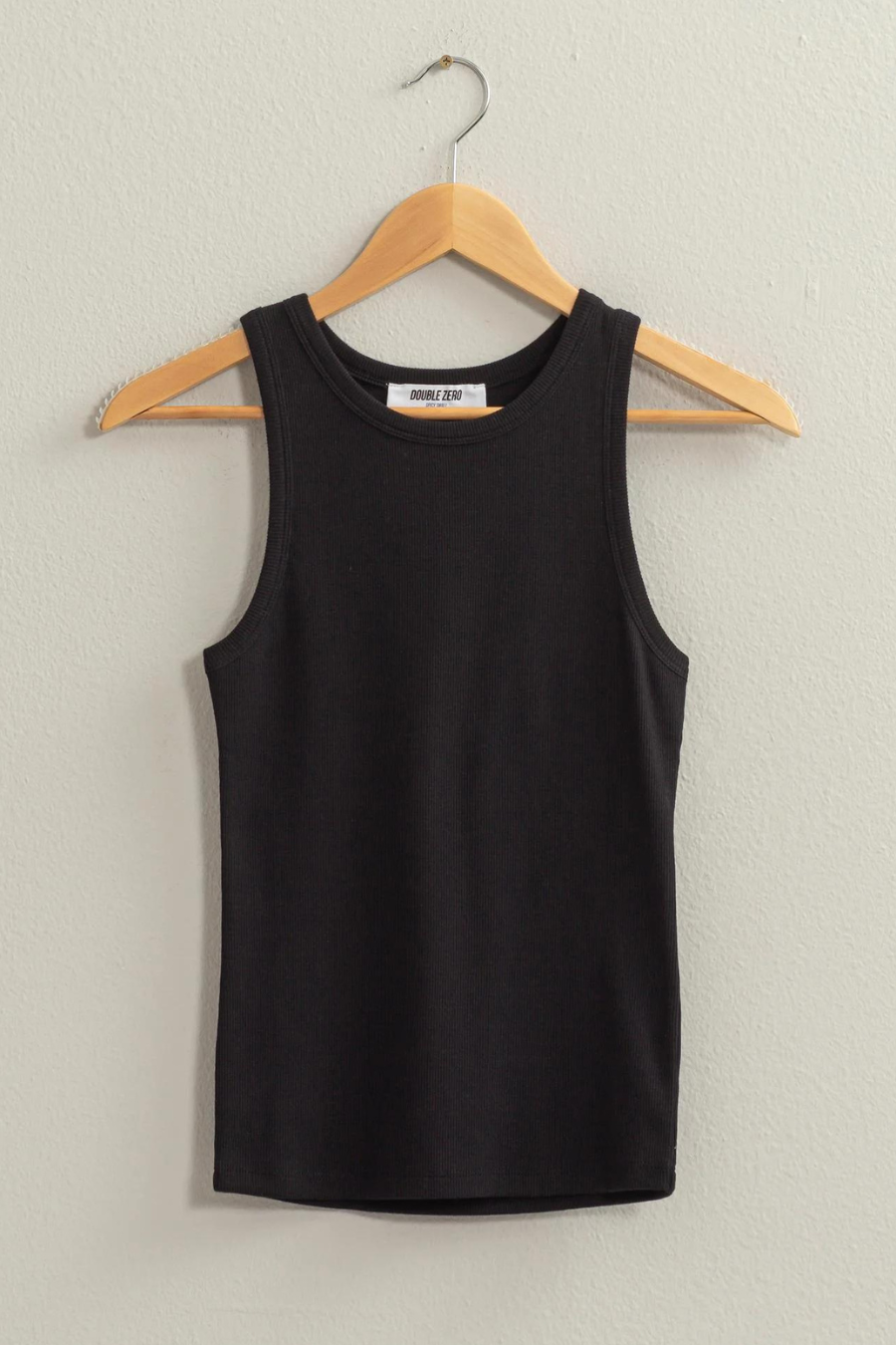 full view of black tank top of wooden hanger 