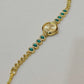 Gold Bracelet Watch with Green Crystals