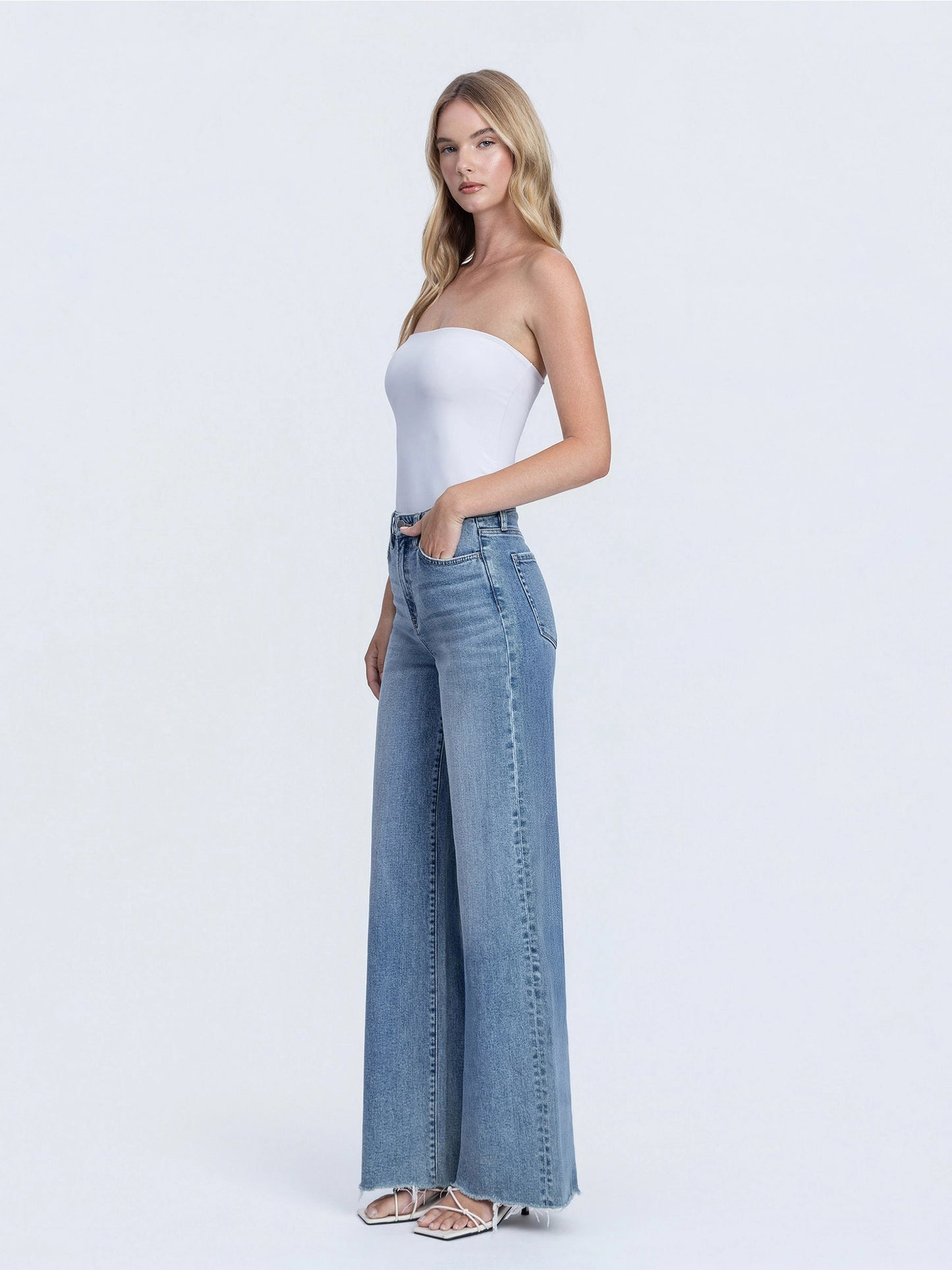 Super High Rise Medium Wash Raw Hem Wide Leg Jeans