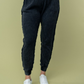 Close up front view of Hanny high waisted thermal knit pants in black