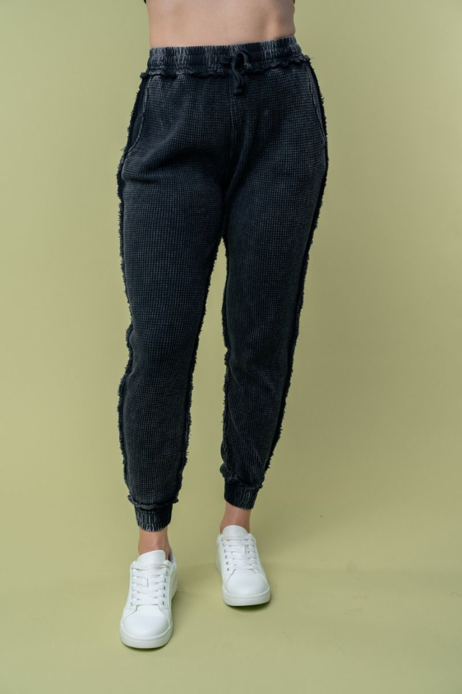 Close up front view of Hanny high waisted thermal knit pants in black