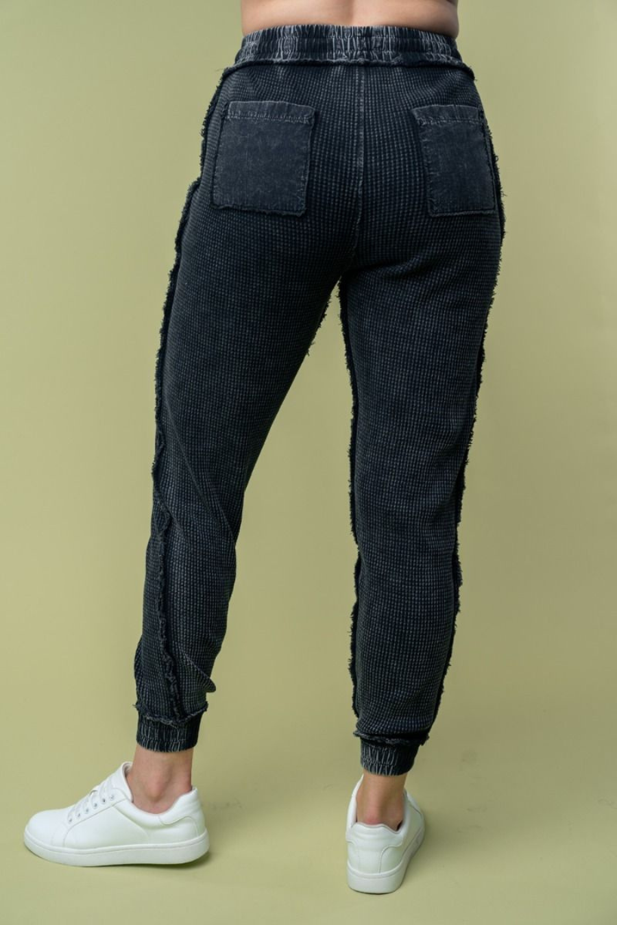 back view of hanny high waisted thermal knit joggers in black, showing off back pockets 