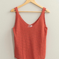 full length shot of brink knit top hanging on hanger