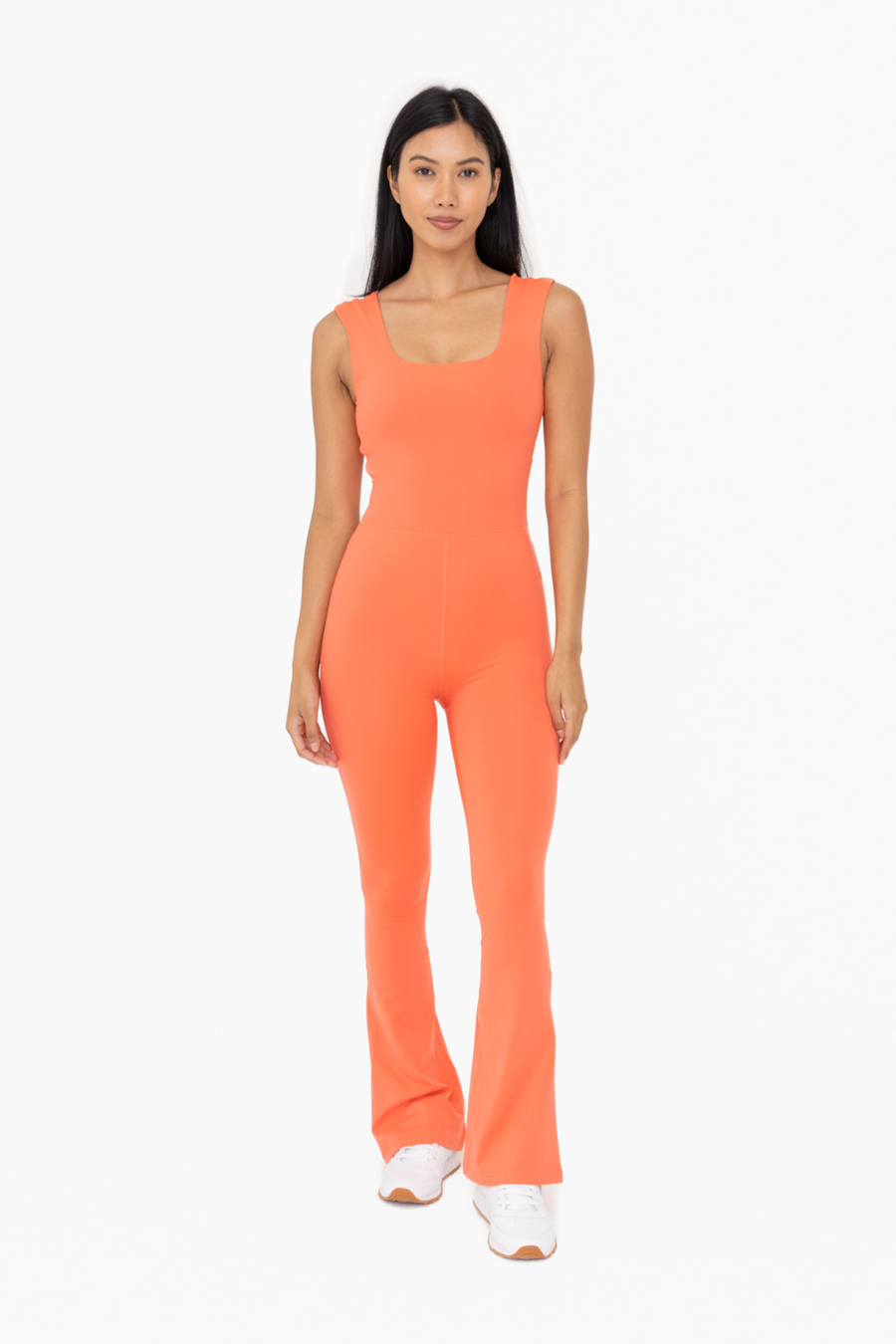 front full length view of the Venice twist back flare jumpsuit  in the color coral