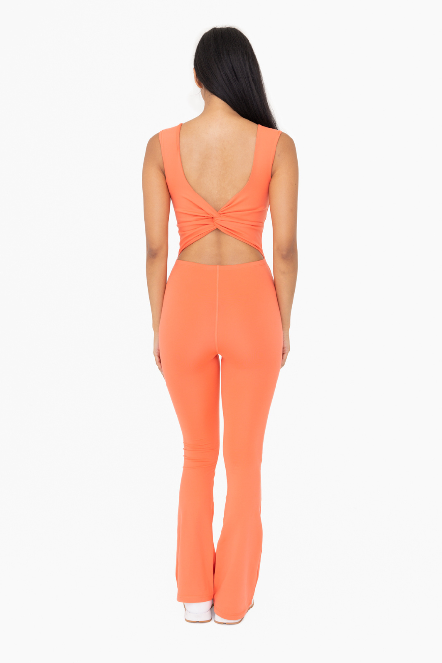 full length back view of venice twist back jumpsuit in the color coral