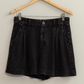 full view of black linen shorts of hanger 