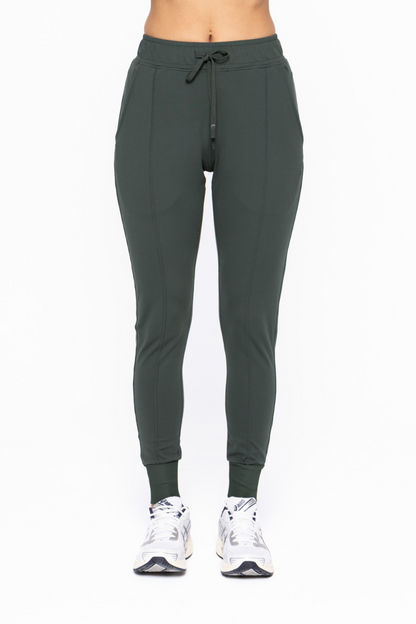 close up front view of Murphy slim fit jogger in the color forest 