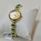 Gold Bracelet Watch with Green Crystals