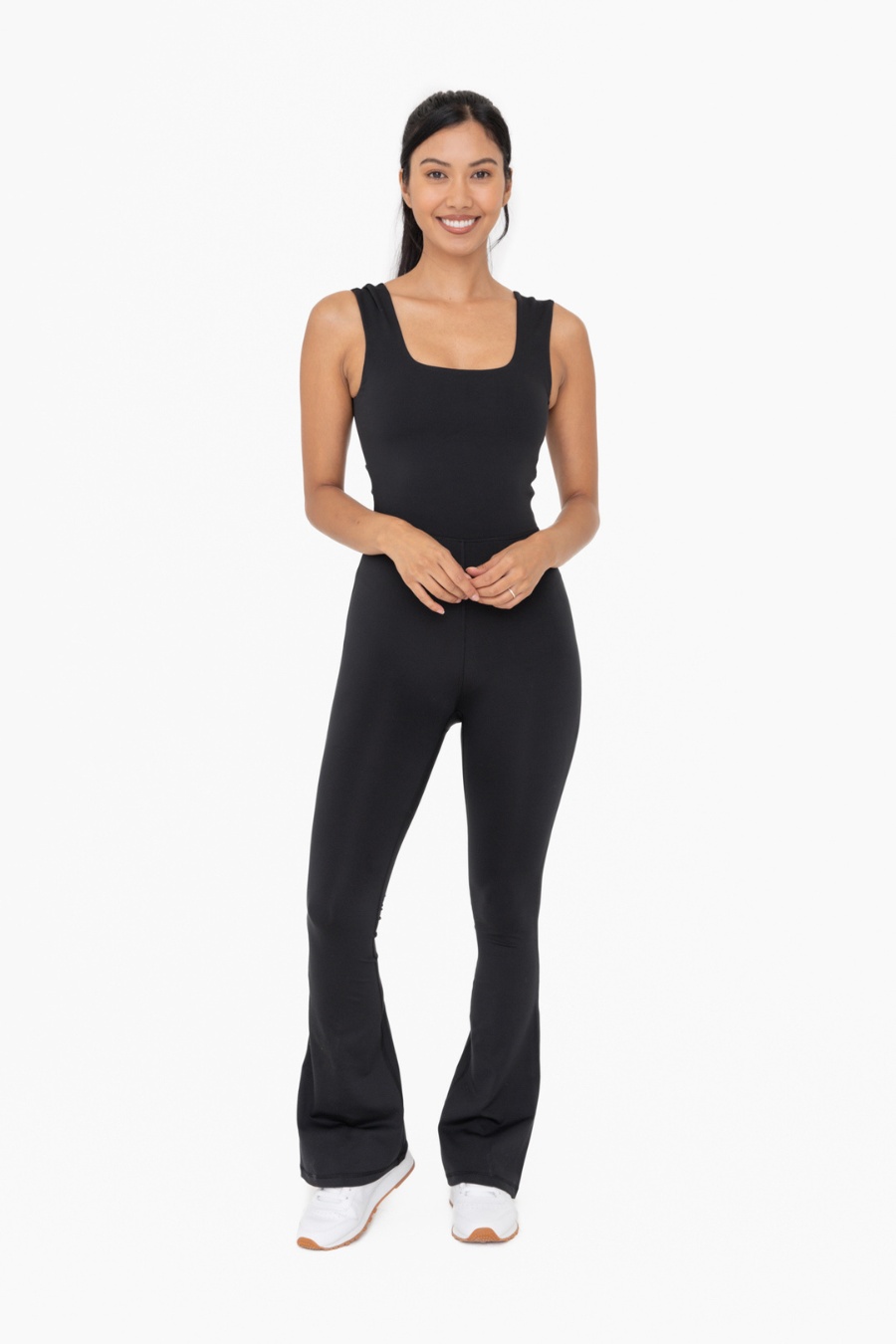 front full length view of the Venice twist back flare jumpsuit  in the color black 