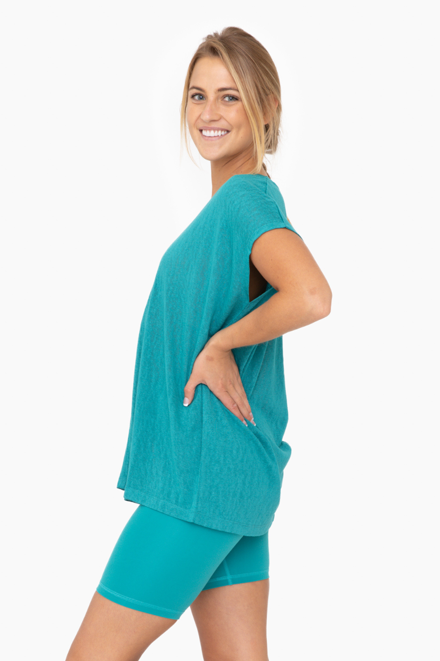 side view of the mina top in the color teal 