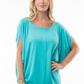 close up front view of capri boat neck short sleeve top in the color aqua, model is wearing top with white jeans