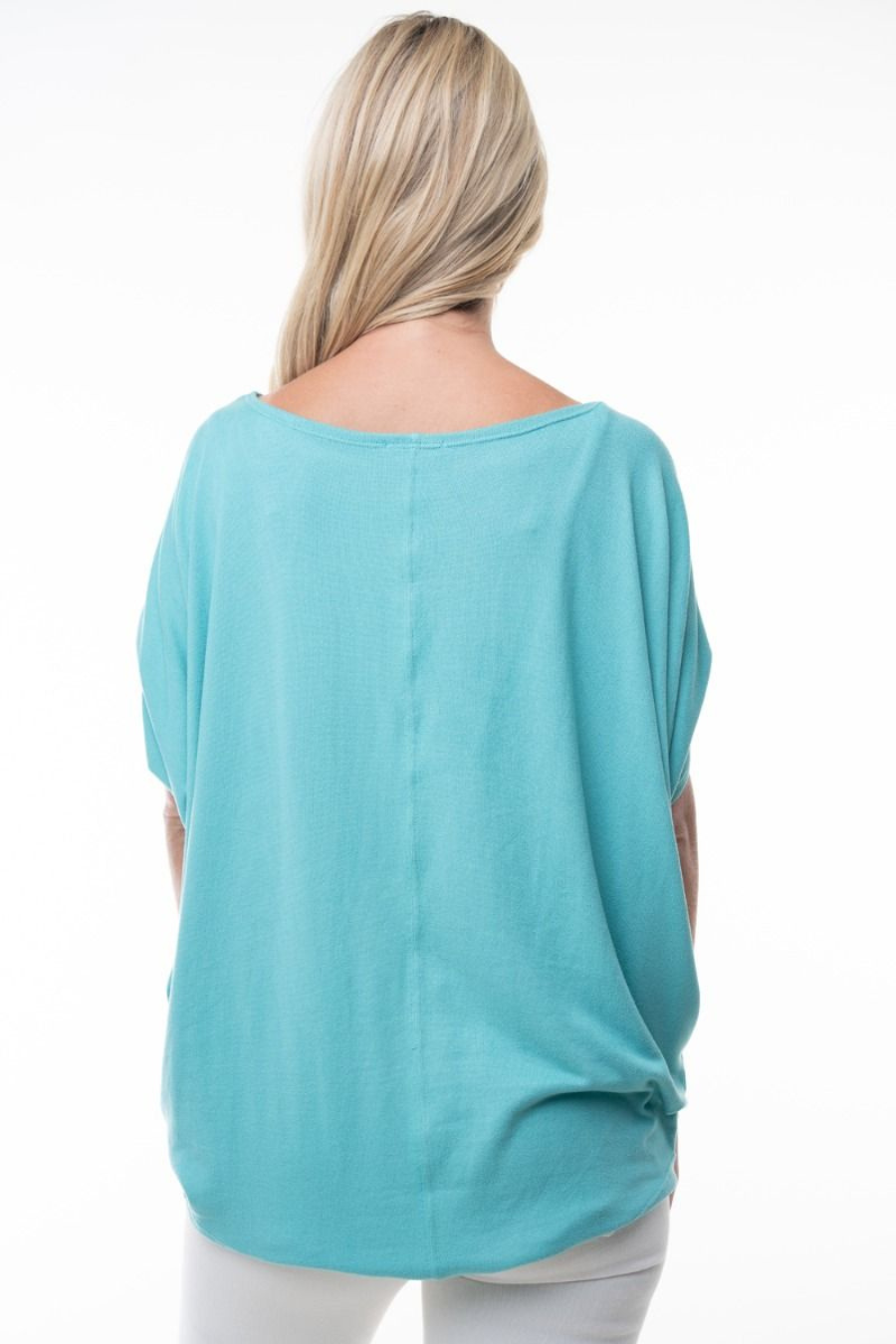 close up back view of capri boat neck short sleeve top in the color aqua, model is wearing top with white jeans