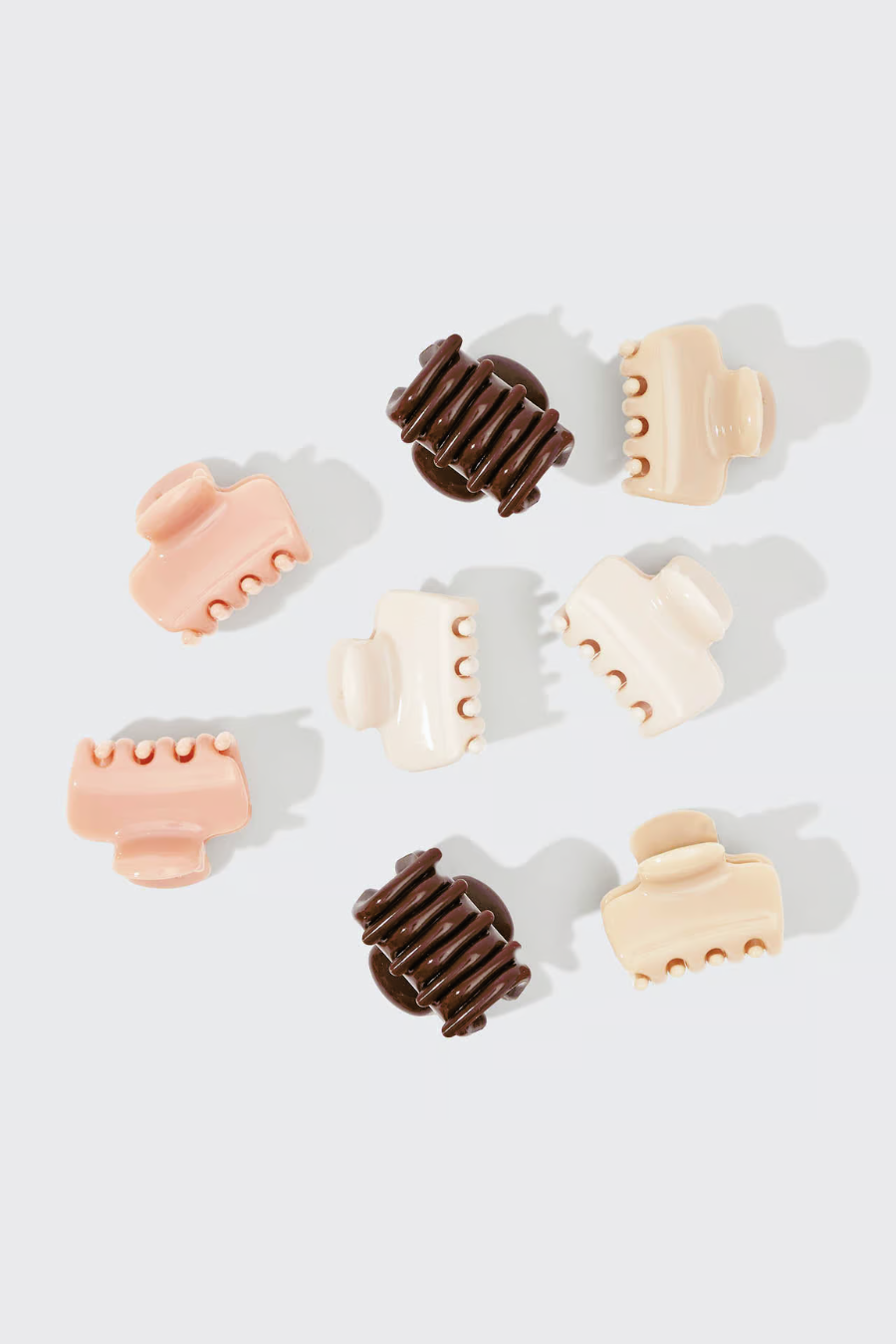 white, tan, blush, cocoa mini claw clips on white background