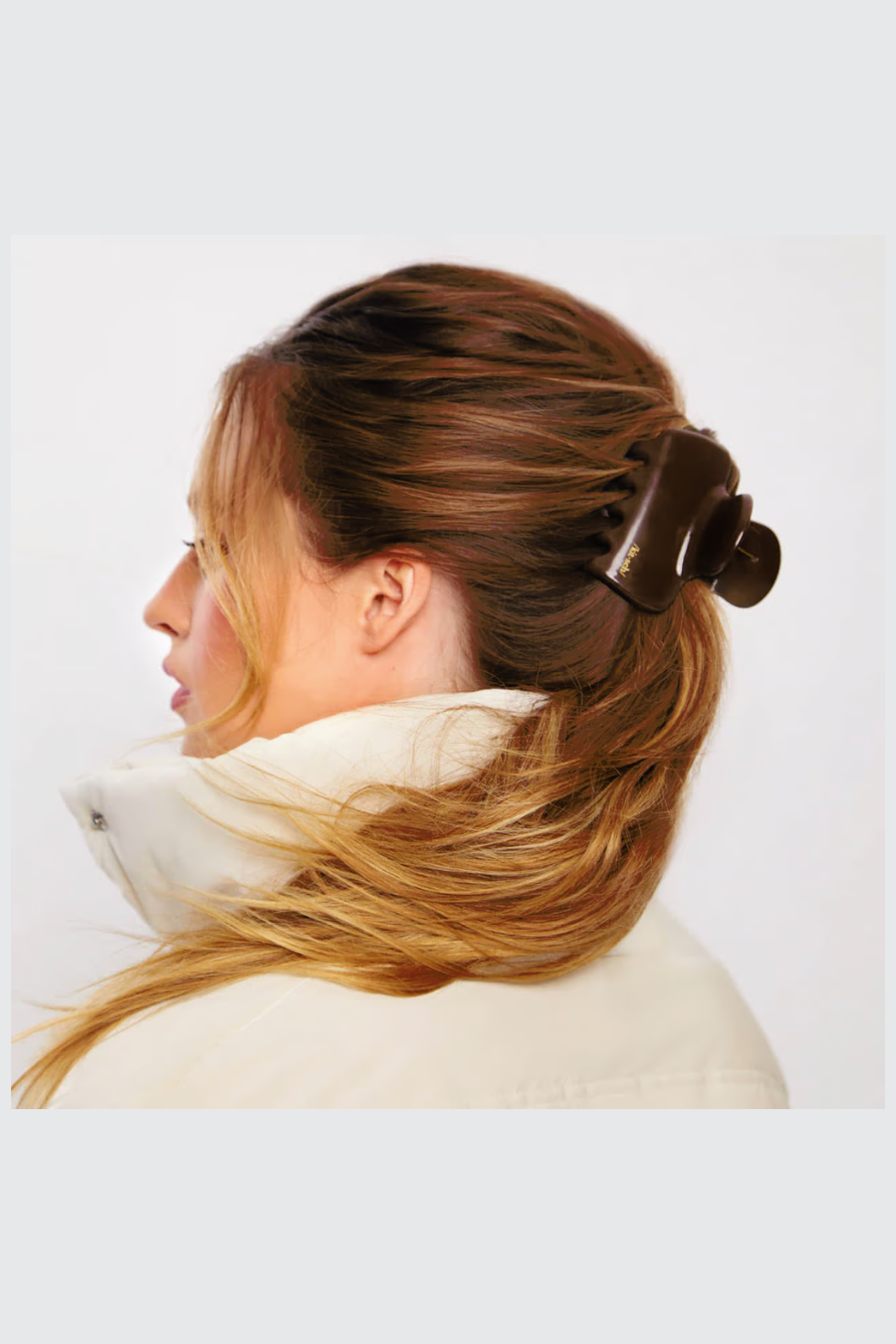 girls hair pulled back into ponytail with cocoa claw clip