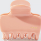 blush claw clip on white background