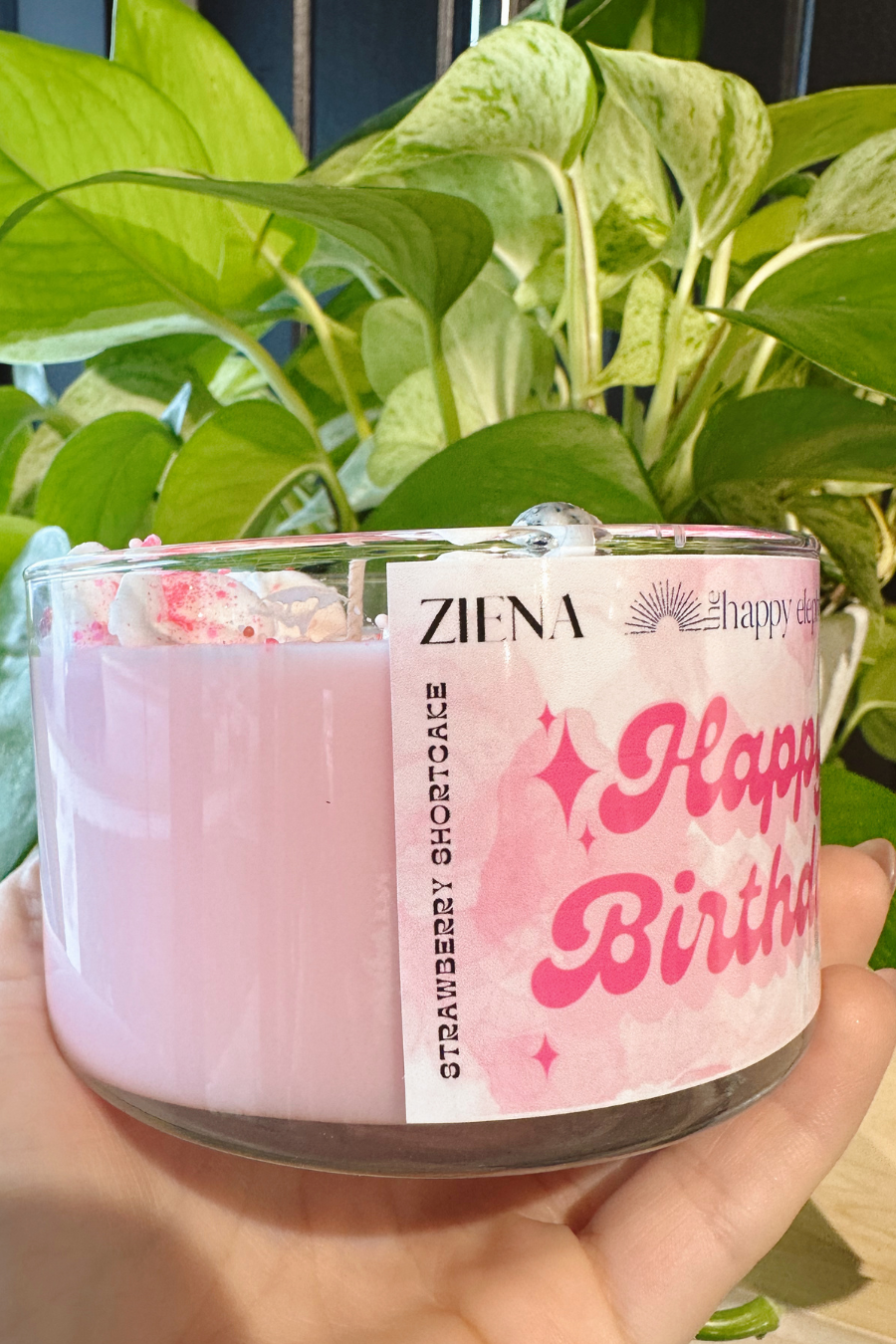 close up of side of happy birthday candle with scent profile of strawberry shortcake 